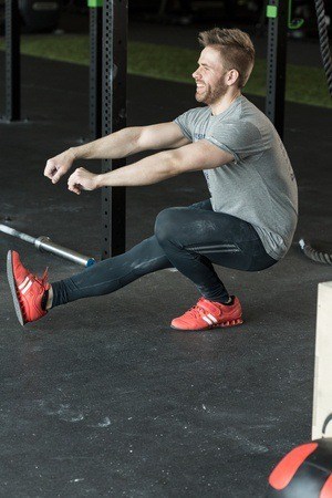 man doing one legged squats