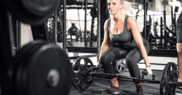 a woman doing trap bar exercises at gym