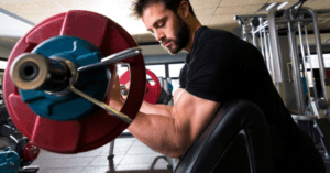 man doing preacher curls exercise