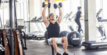 a man doing arnold press exercise